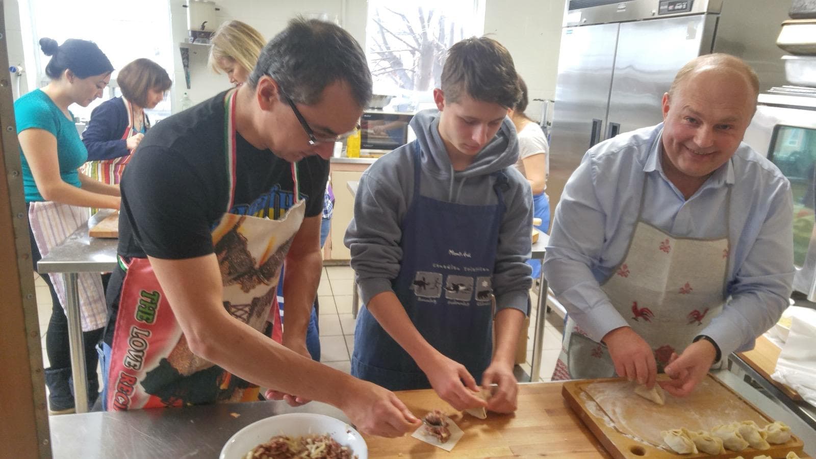 Participants preparing traditional Crimean Tatar food during a community cooking workshop.