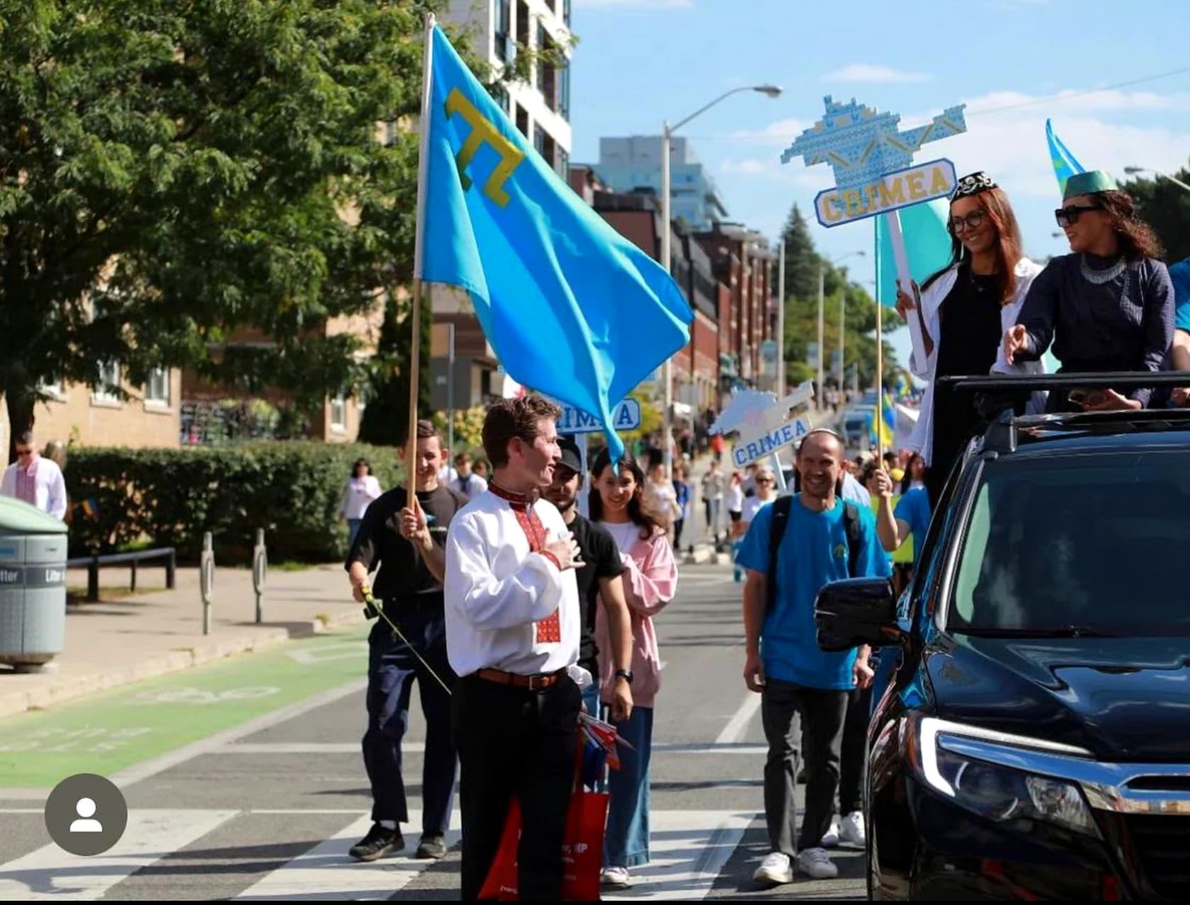 Crimean Tatar community members participating in a cultural parade in Canada.