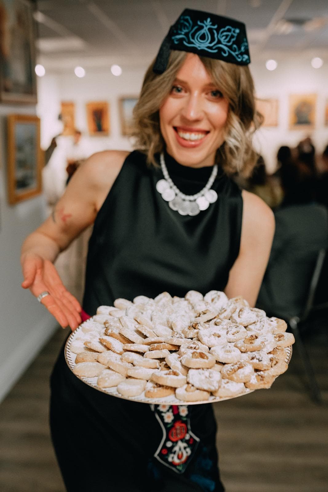 Crimean Tatar pastries being presented at a cultural gathering.